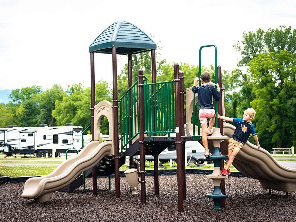 Kids playing at playground at PIGEON FORGE LANDING RV RESORT