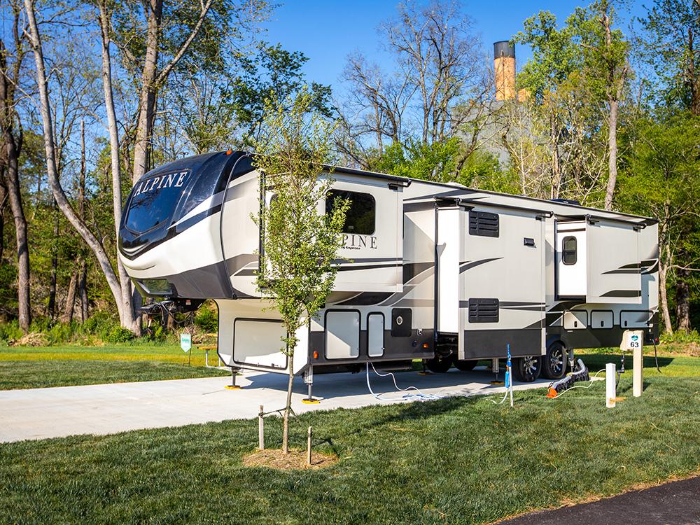 5th wheel parked on a paved site at PIGEON FORGE LANDING RV RESORT