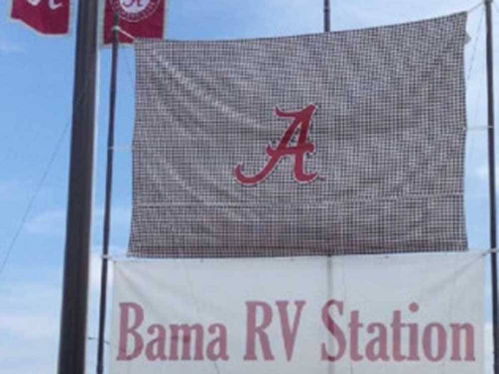 Business name and Alabama logo on a flag at BAMA RV STATION