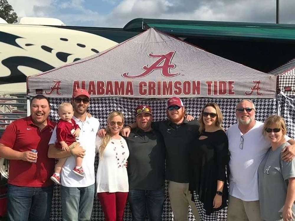 Fans tailgating for football game at BAMA RV STATION