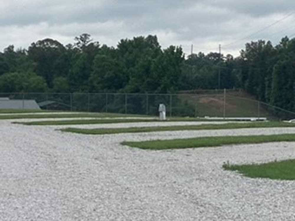A row of the empty gravel sites at BAMA RV STATION