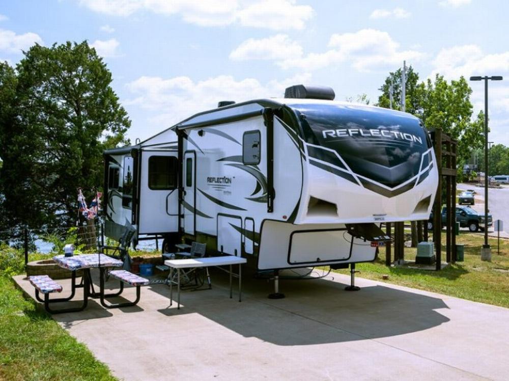 Trailer parked next to panic table at Elm Hill RV Resort