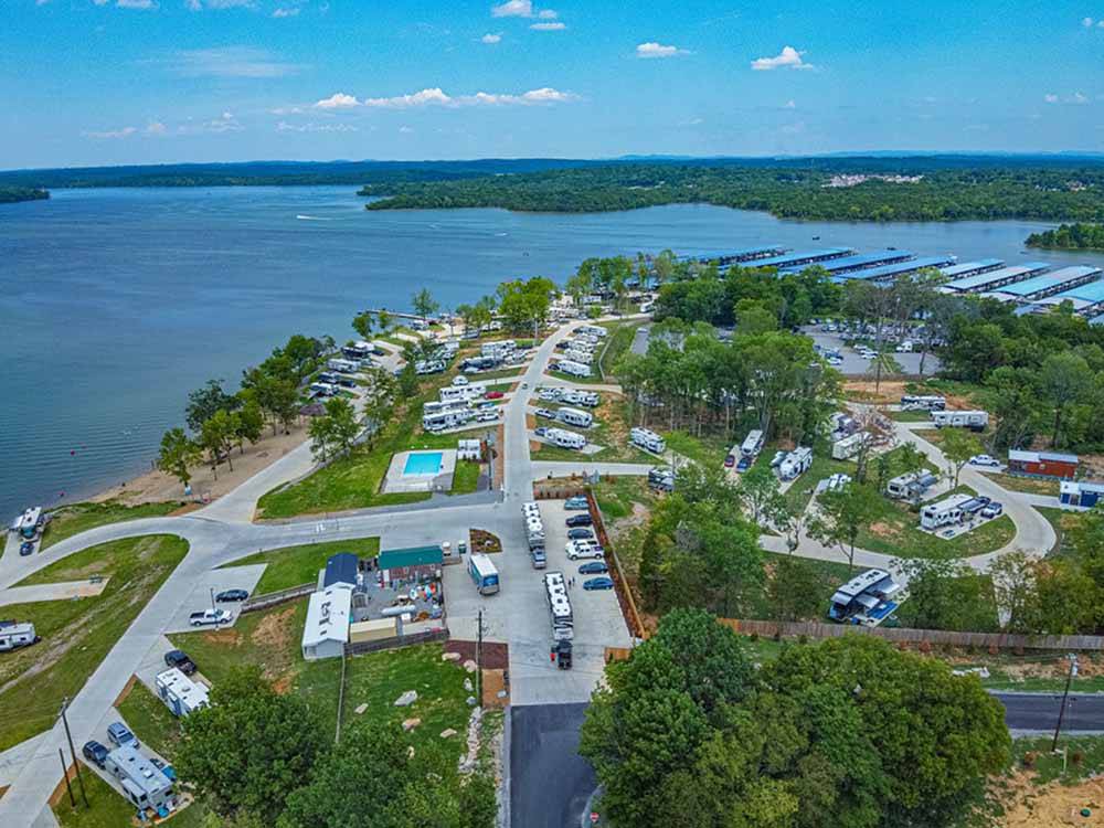 An aerial view of the campsites by the water at FOUR CORNERS RV RESORT