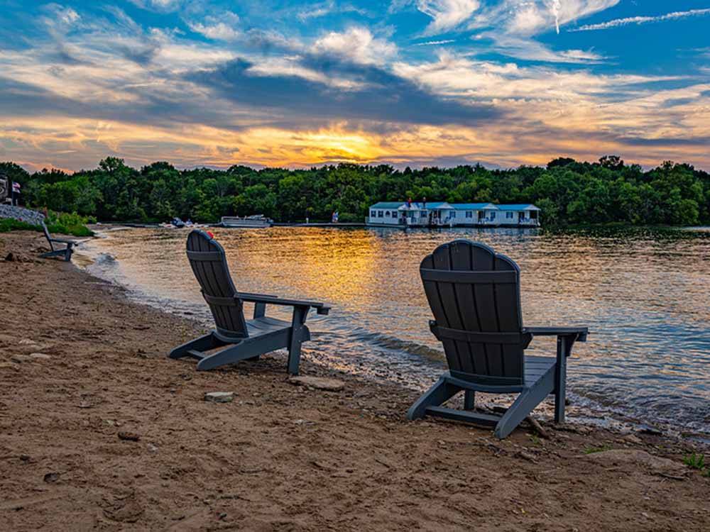 Two chairs overlooking the water at FOUR CORNERS RV RESORT