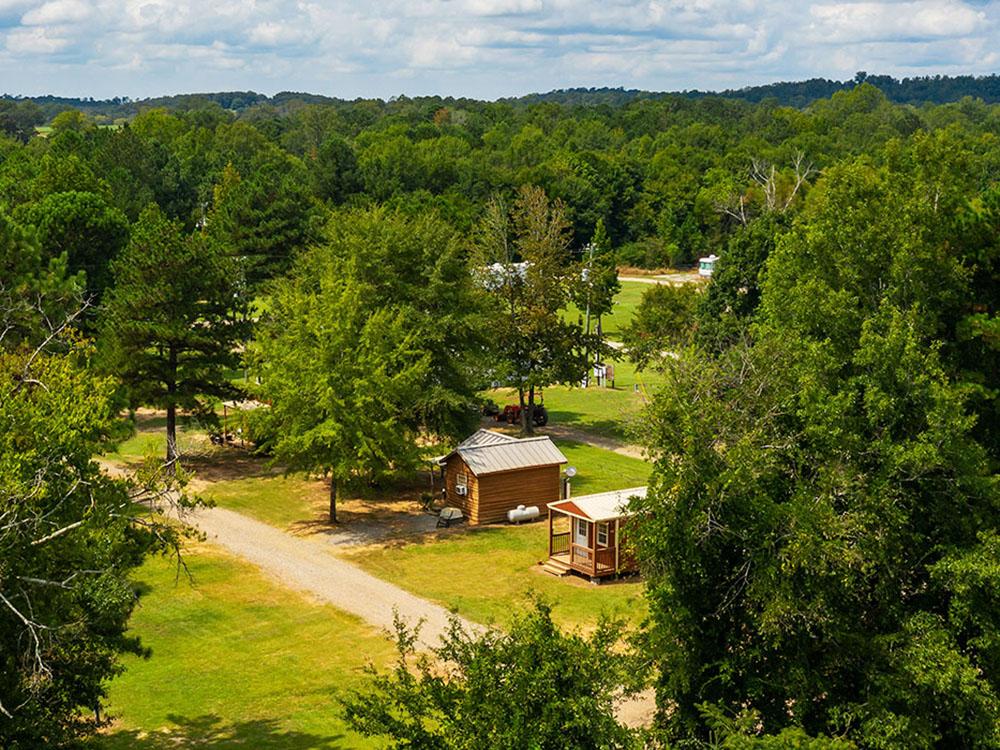 Aerial view of cabins among trees at TALLADEGA PIT STOP RV PARK & CAMPGROUND