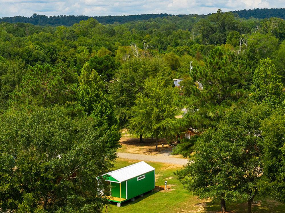 Aerial view of a cabin among trees at TALLADEGA PIT STOP RV PARK & CAMPGROUND