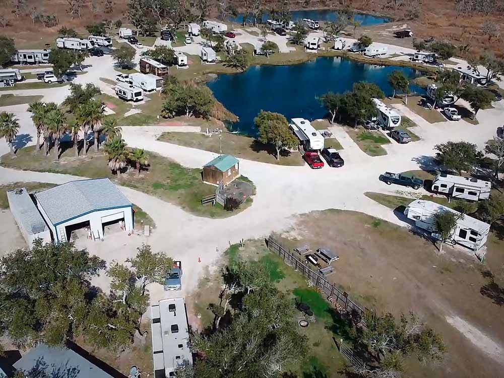 An aerial view of the campsites and lake at QUILLY'S BIG FISH RV PARK