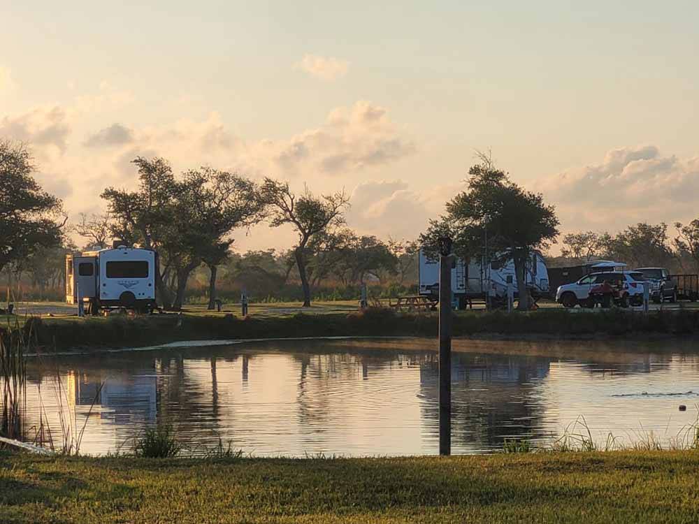 Some RV sites by the lake at QUILLY'S BIG FISH RV PARK