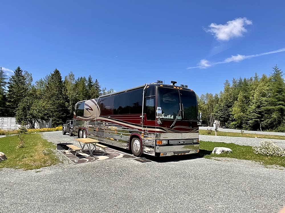 Class A Motorhome parked on RV site at WEST BAY ACADIA RV CAMPGROUND