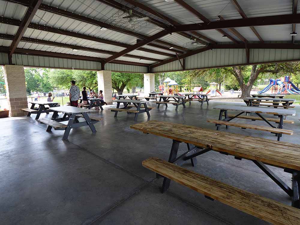 A pavilion with picnic benches at MINEOLA CIVIC CENTER & RV PARK