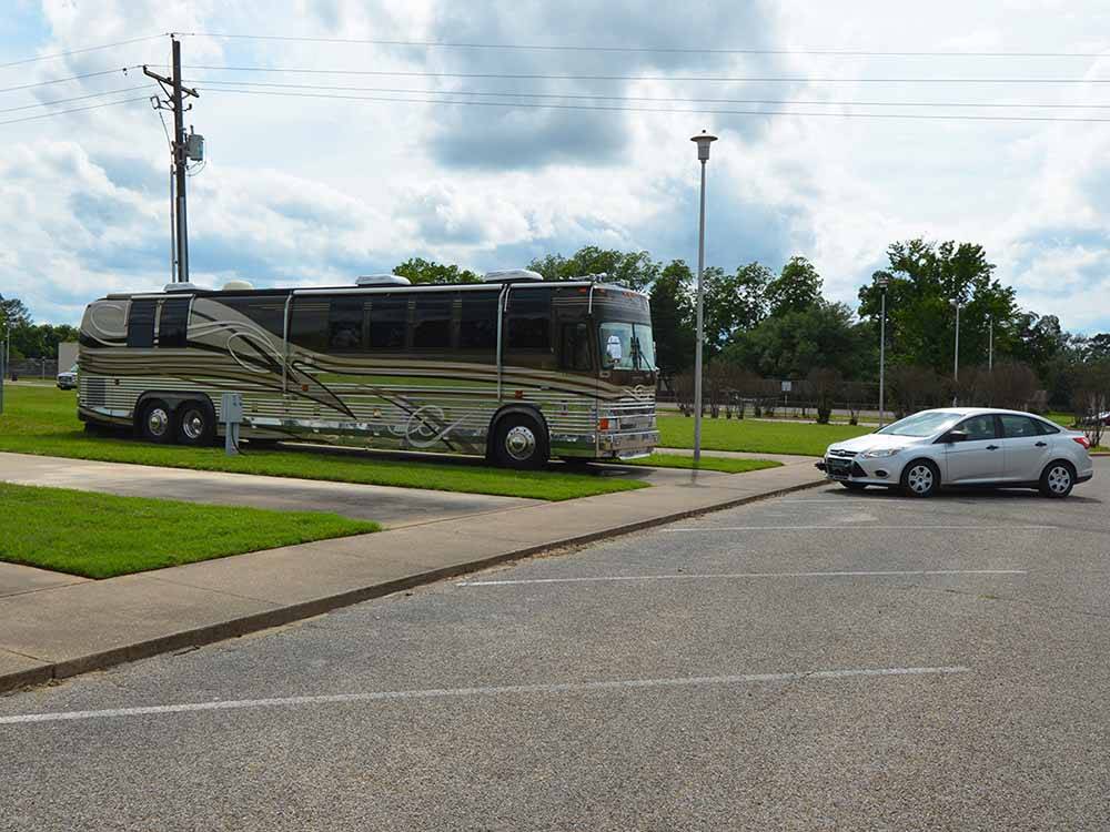A bus conversion on a paved RV site at MINEOLA CIVIC CENTER & RV PARK
