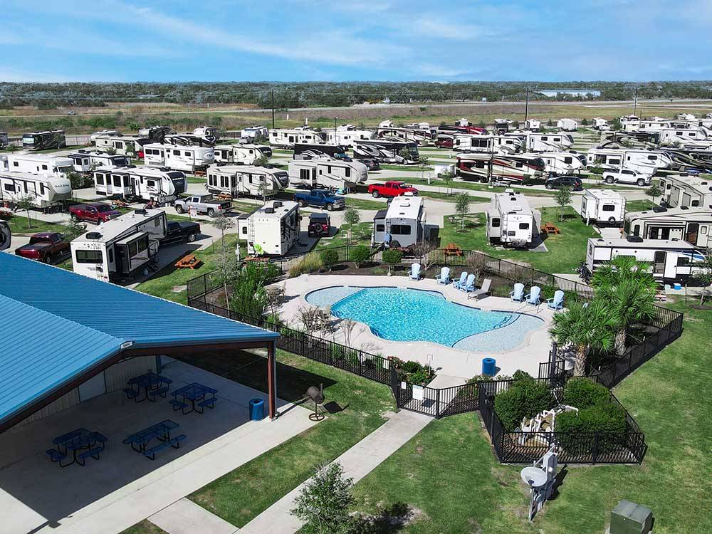 An overhead view of the pool and RVs parked at REEL CHILL RV RESORT