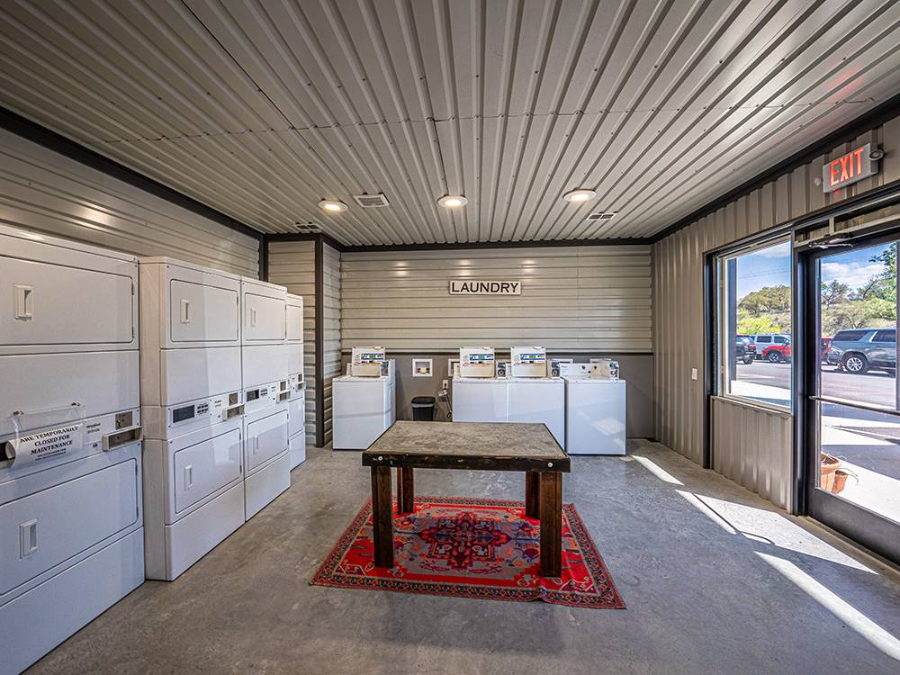 The laundry room with a table for folding at Riverwalk RV Resort