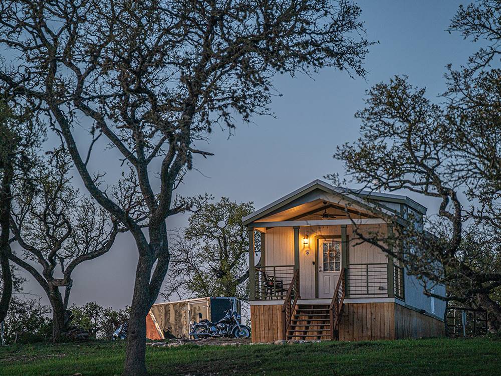 One of the rentals at dusk at Riverwalk RV Resort