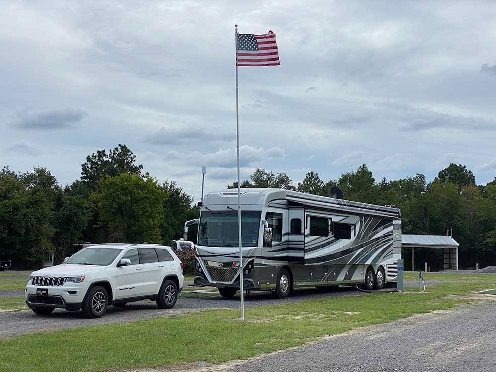 An American Flag in front of a motorhome at BIG RIG FRIENDLY RV RESORT