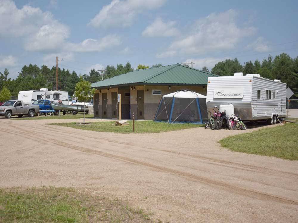 RVs parked near main building at EVERGREEN PARK & CAMPGROUND