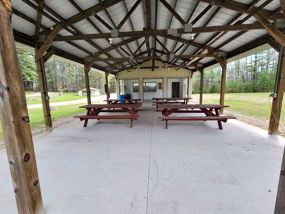 Picnic tables under the pavilion at EVERGREEN PARK & CAMPGROUND