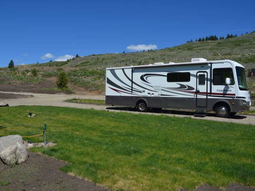 Class A motorhome arriving at campsite at SUMMIT RV RESORT