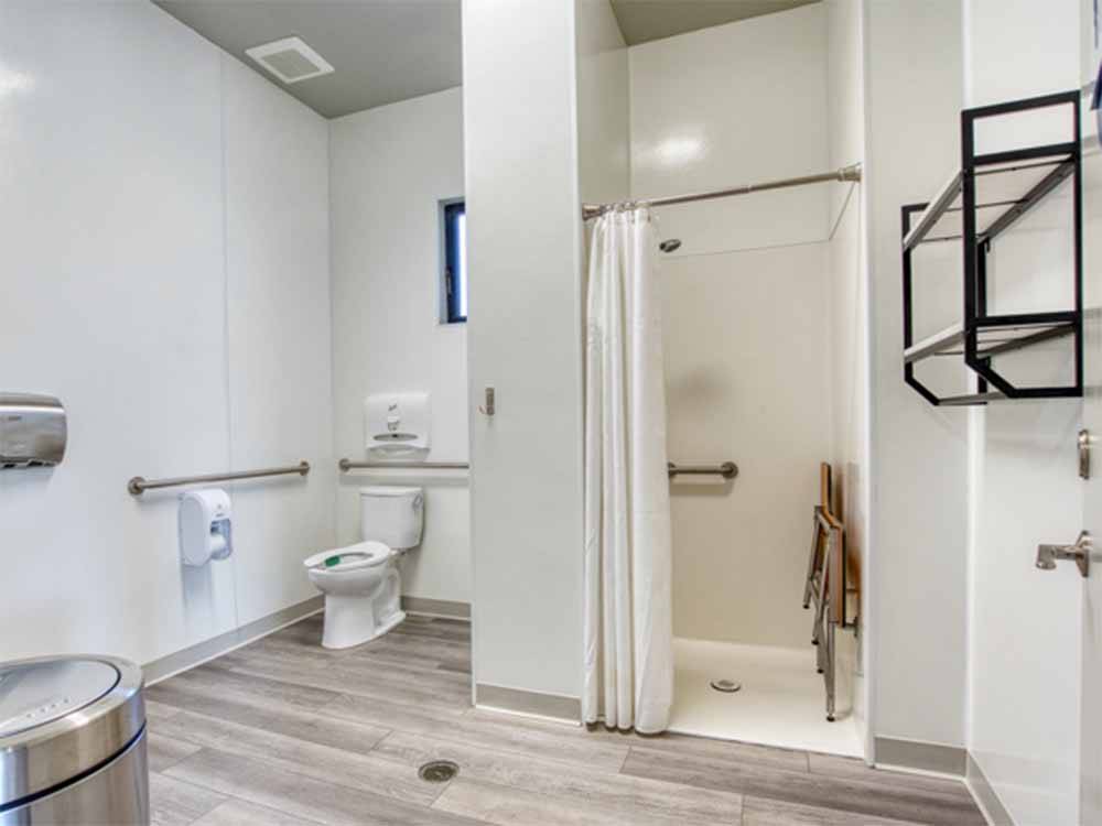 Inside a large bathroom and shower at COACHELLA LAKES RV RESORT