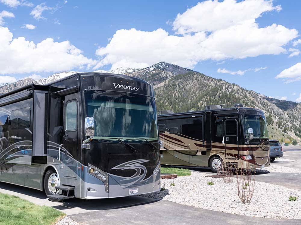 Two motorhomes parked on-site at ALPINE VALLEY RV RESORT