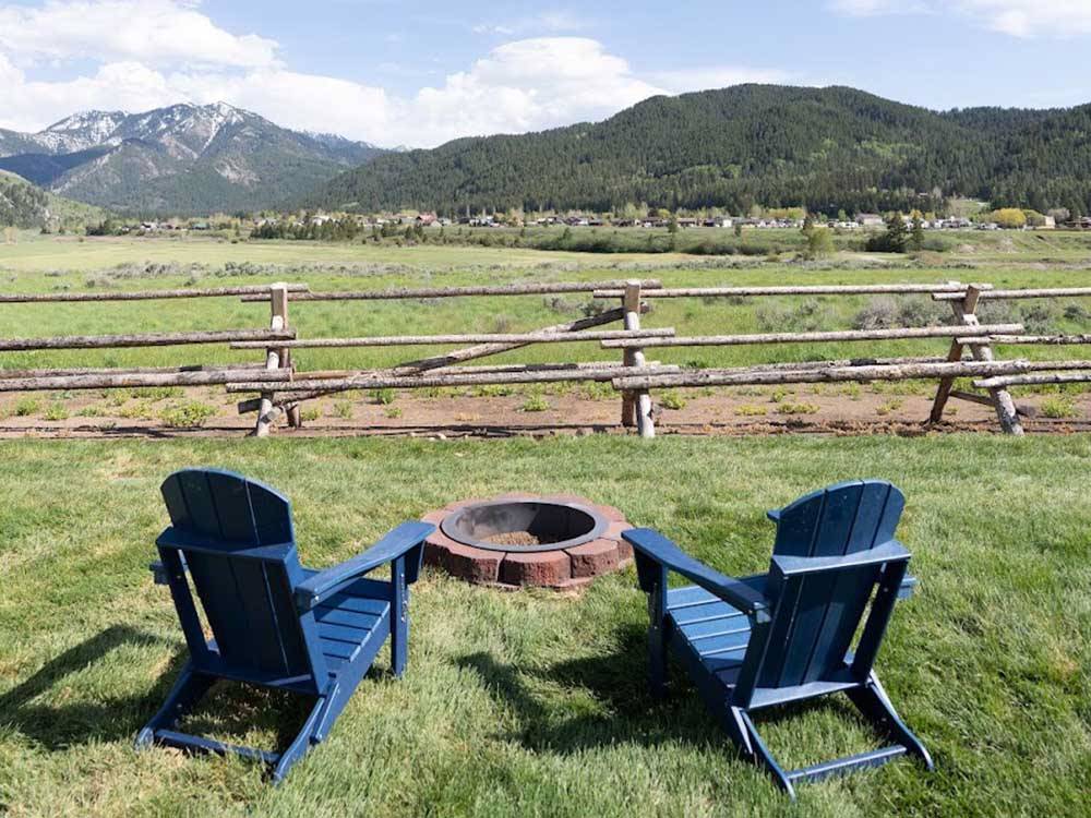 Two chairs set up near a fire pit ALPINE VALLEY RV RESORT