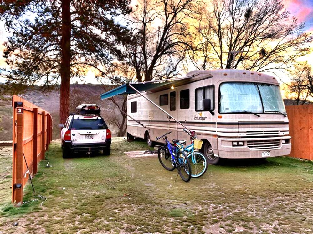 RV, car and bikes in a ite
