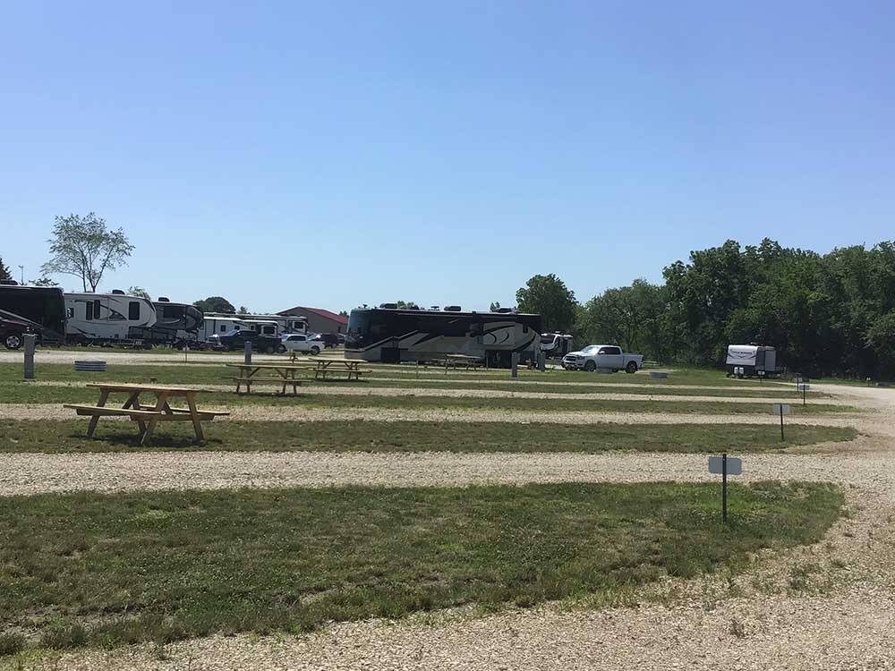 Empty RV sites with picnic tables at CROWS NEST RV RESORT