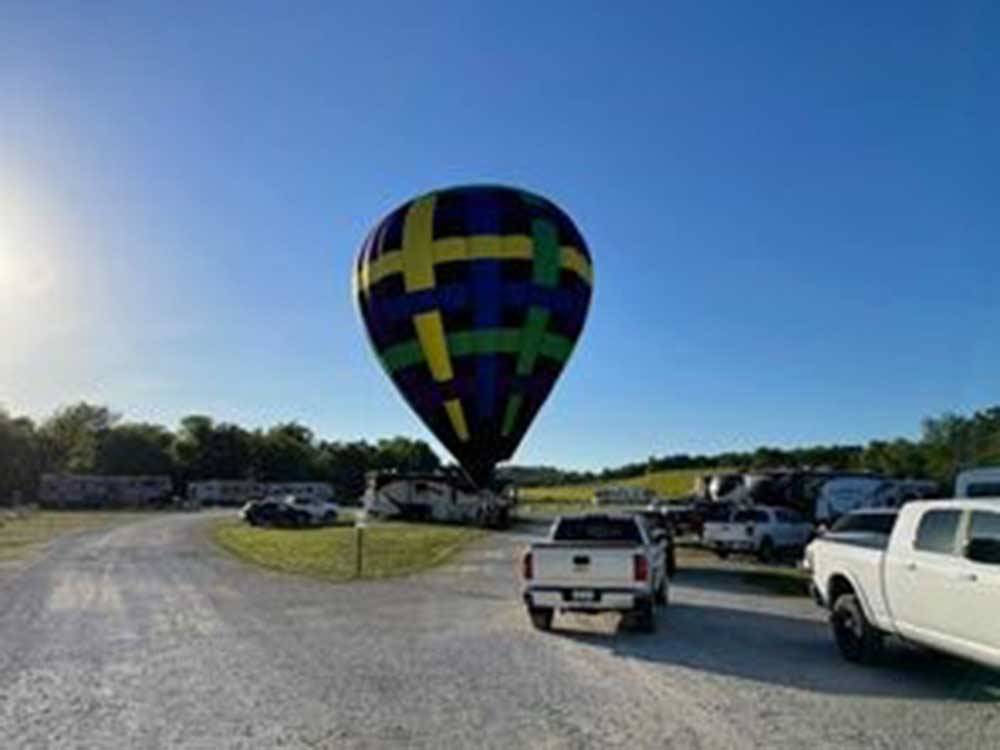 Hot air balloon on the ground in RV campground at CROWS NEST RV RESORT