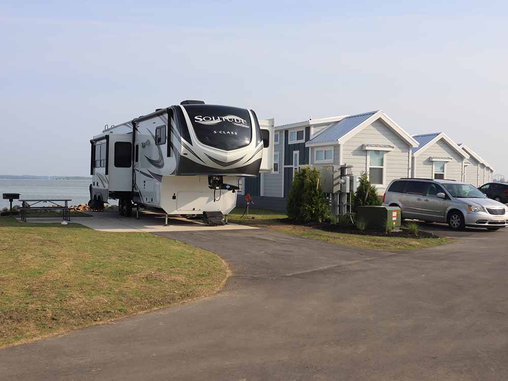 A fifth wheel trailer parked next to the model homes at BAYFRONT RESORT AT CROSS VIEW