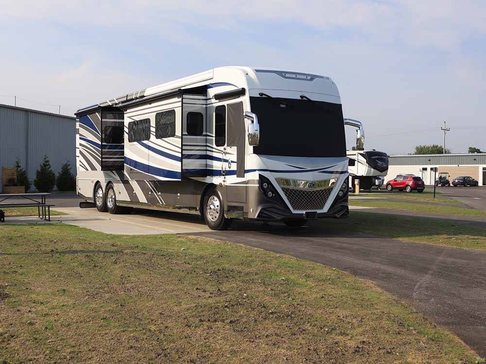 A motorhome parked in a paved site at BAYFRONT RESORT AT CROSS VIEW