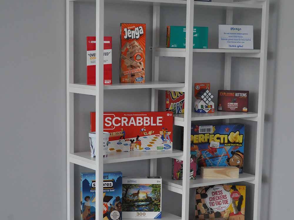 Board games on a rack in the rec room at BAYFRONT RESORT AT CROSS VIEW