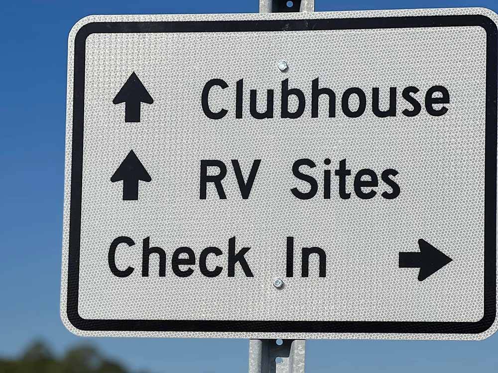 A directional sign for the campground at 30A LUXURY RV RESORT