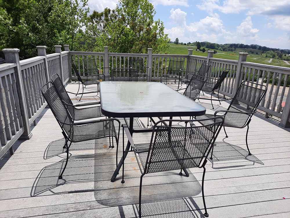 A patio table on the deck at MEDALLION CAMPGROUND - BRISTOL MOTOR SPEEDWAY