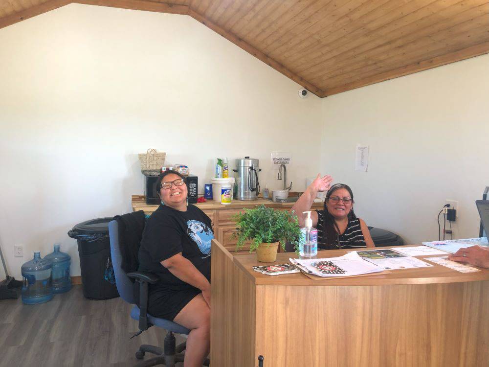 Employees greeting guests at the front desk at Buffalo Calf Campground