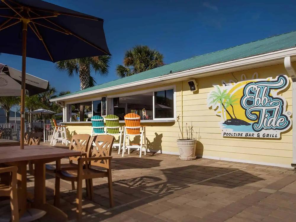 Bar and grill with outdoor seating at OCEAN GROVE RV RESORT