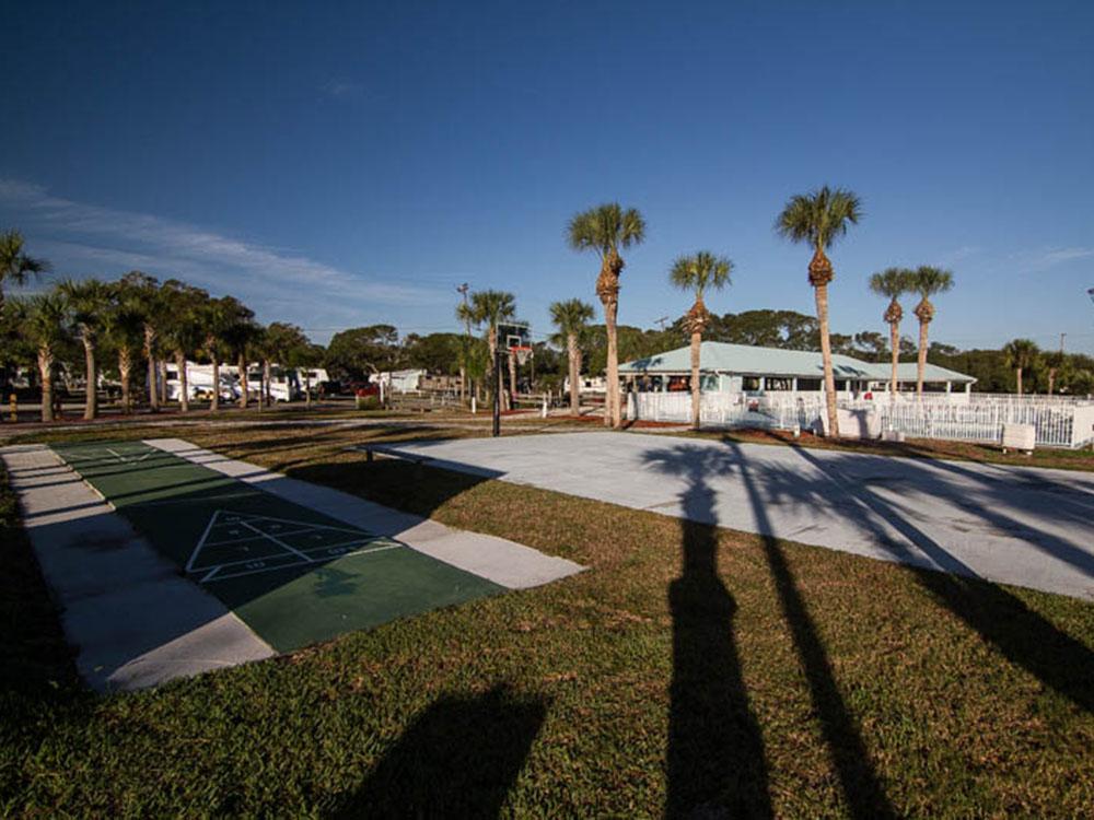 Palm tree shadows over RV lots at OCEAN GROVE RV RESORT