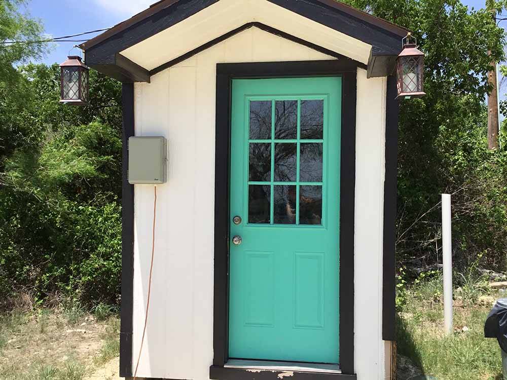 Exterior view of outhouse at OFF THE VINE RV PARK