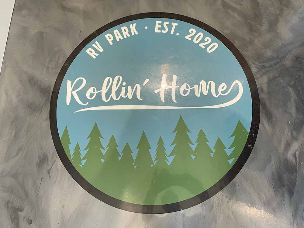 The Rollin' Homes logo on the floor at ROLLIN' HOME RV PARK