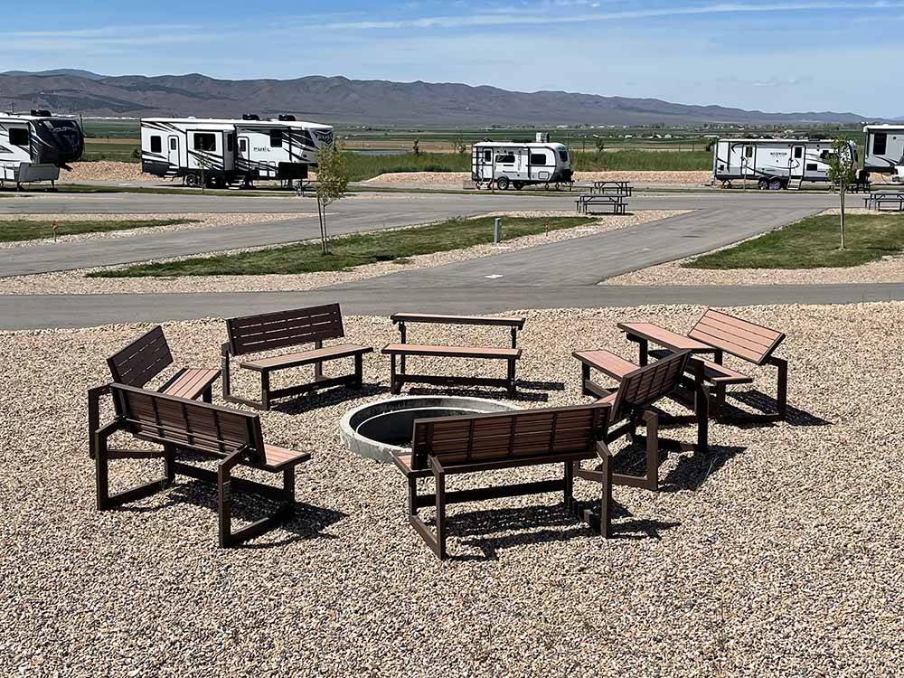 Seating around a fire pit at ROLLIN' HOME RV PARK