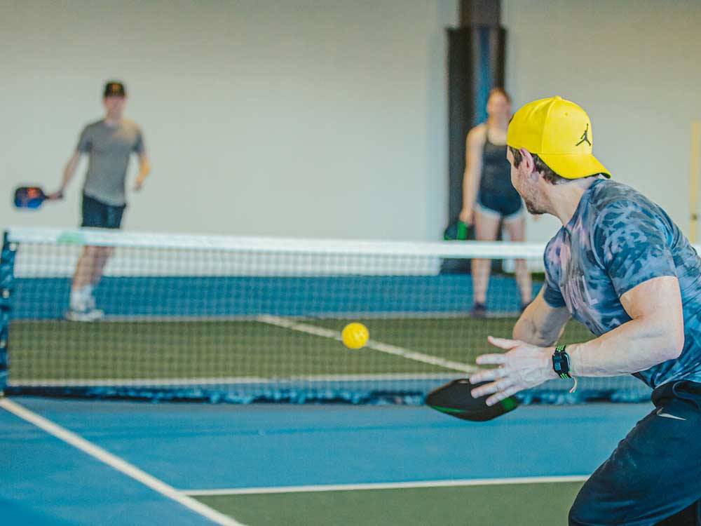 Couples playing pickle ball at TRYON INTERNATIONAL RV RESORT