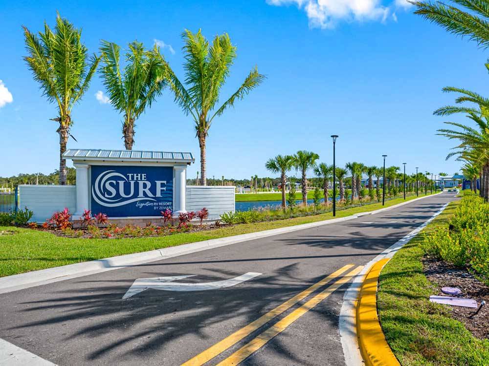 The front entrance sign and driveway at THE SURF RV RESORT