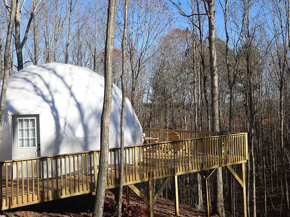 A deck off of one of the rental geodesic domes at BROAD RIVER CAMPGROUND
