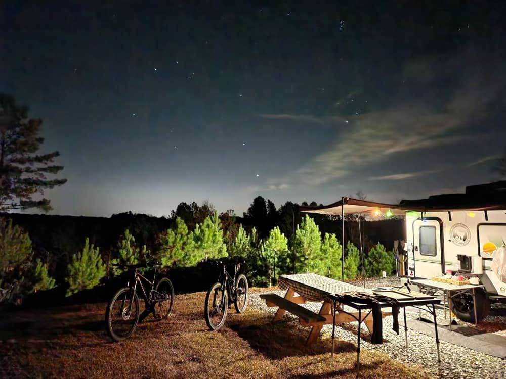 A campsite lit up at night at BROAD RIVER CAMPGROUND
