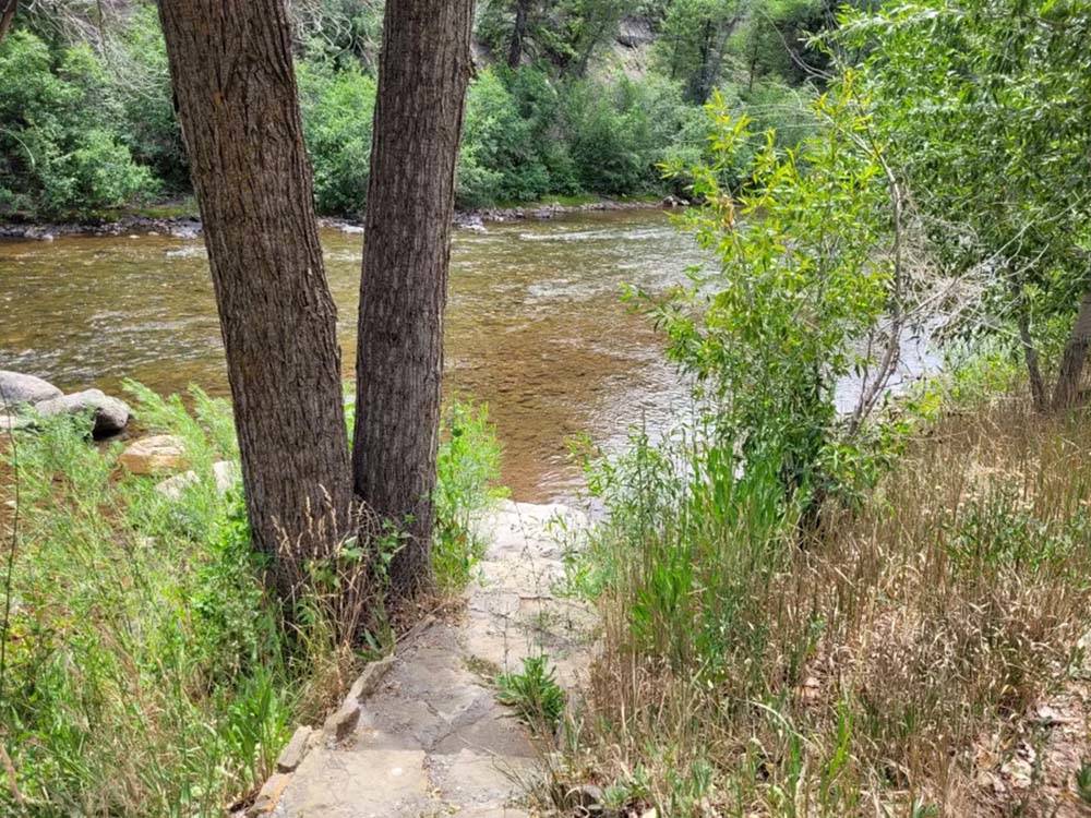 A path to get to the river at OUTPOST MOTEL CABINS AND RV PARK