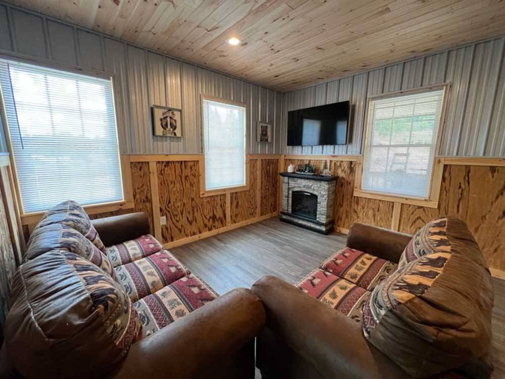 Living room and fireplace in luxury suite at BRUSHCREEK FALLS RV RESORT