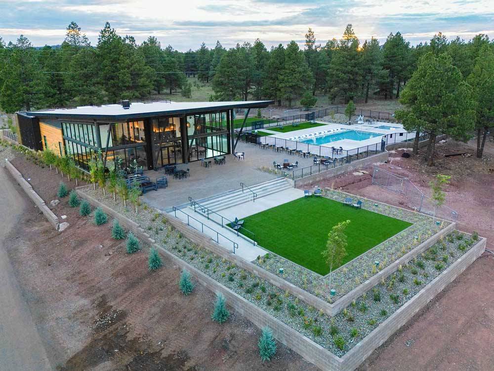 Aerial view over the lobby, swimming pool and green area at VILLAGE CAMP FLAGSTAFF