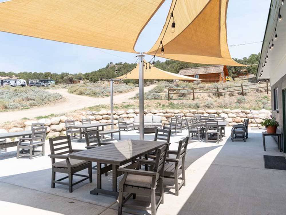 Outdoor dining tables and shade areas at BV OVERLOOK CAMP & LODGING