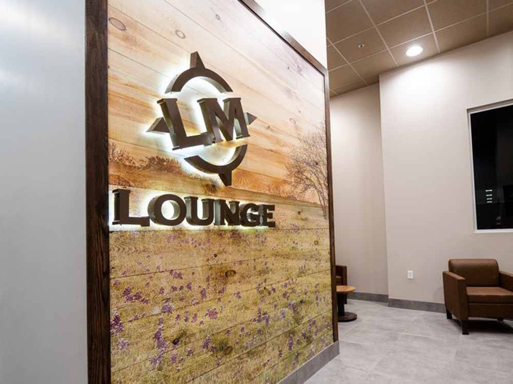 The sign to the lounge at LANDMARK TRAVEL CENTER RV PARK