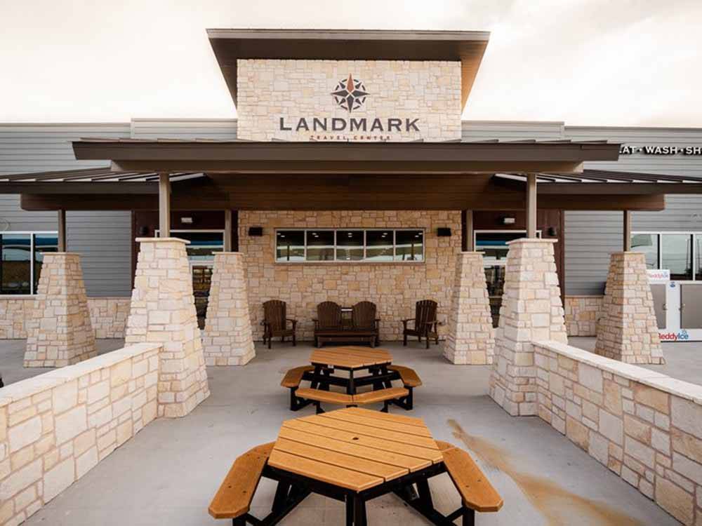 An outdoor seating area at LANDMARK TRAVEL CENTER RV PARK