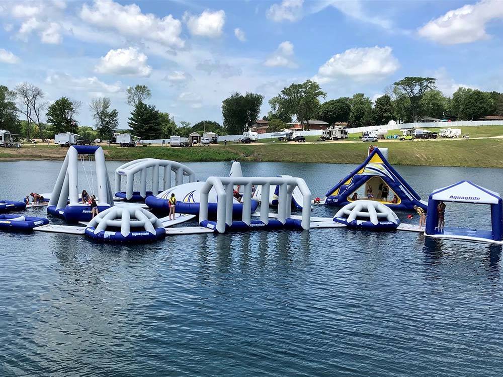 Families on the Aquaglide obstacle course at COCONUT COVE RV RESORT BY RJOURNEY